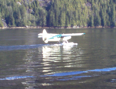 A float plane lands to look at the falls