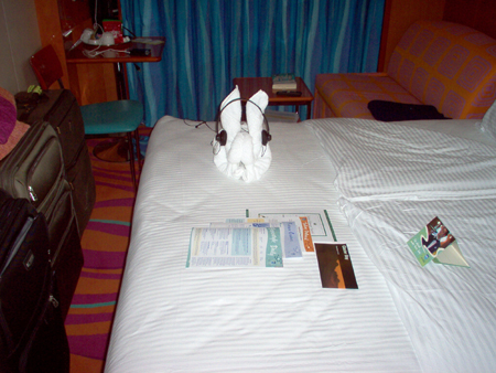 Gladys, the house keeper for our state room made a bunny with a towel and Steve's Headphones