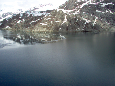 An interesting contrast, rippled water on the right, then ice, then smooth water on the left