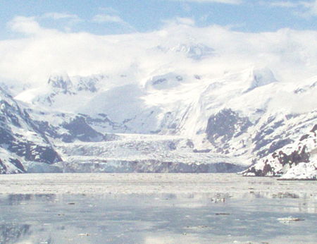 Note the darkened patches on the edges and in the middle of the glacier