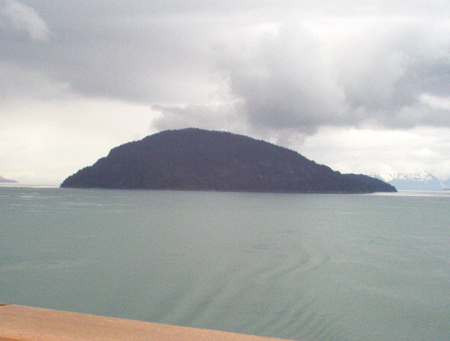 Notice the clouds moving in over this island?