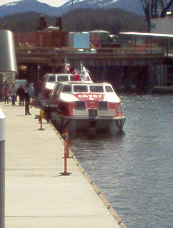 The ship's tenders loading passengers