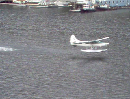 A float plane lifts off